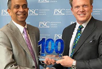 Jim Garrettson, CEO of Executive Mosaic, Presents PV Puvvada, President of Unisys Federal Systems, His Fifth Wash100 Award