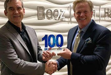 Jim Garrettson, CEO of Executive Mosaic, Presents Greg Wenzel, EVP at Booz Allen, His First Wash100 Award