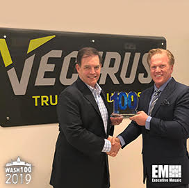 Jim Garrettson, CEO of Executive Mosaic, Presents Chuck Prow, President and CEO of Vectrus, His Fifth Wash100 Award
