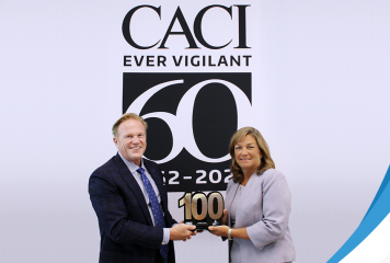Executive Mosaic CEO Jim Garrettson Presents 6th Wash100 Award to DeEtte Gray, President of CACI’s Business & IT Solutions Sector