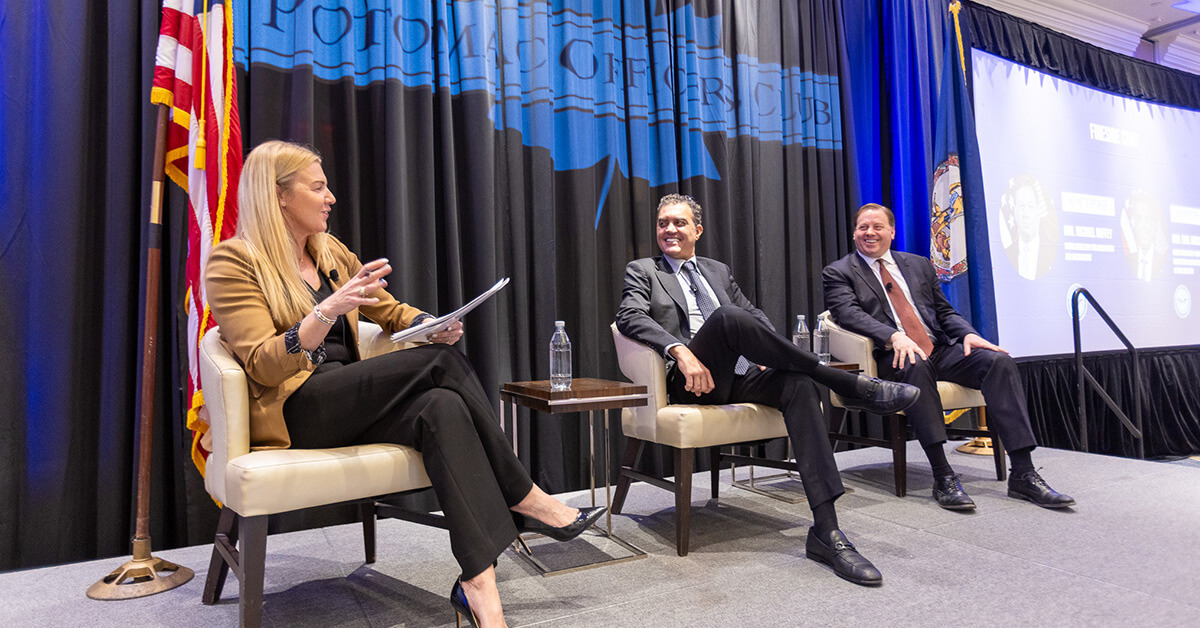 Carrie Wibben Kaupp, Emil Michael and Michael Duffey. Exiger leader moderates fireside chat between two Pentagon officials